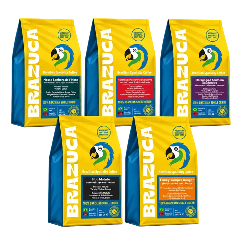 Five bags of BRAZUCA Brazilian Specialty Coffee arranged on a white background, with three bags standing upright in the back and two bags angled in front. The bags are bright yellow and blue with a large parrot logo and product variety labels in different colors.
