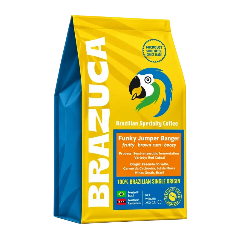 A 250g bag of Brazuca Brazilian Specialty Coffee, 'Funky Jumper Banger', featuring a bright yellow and blue package with a parrot logo.